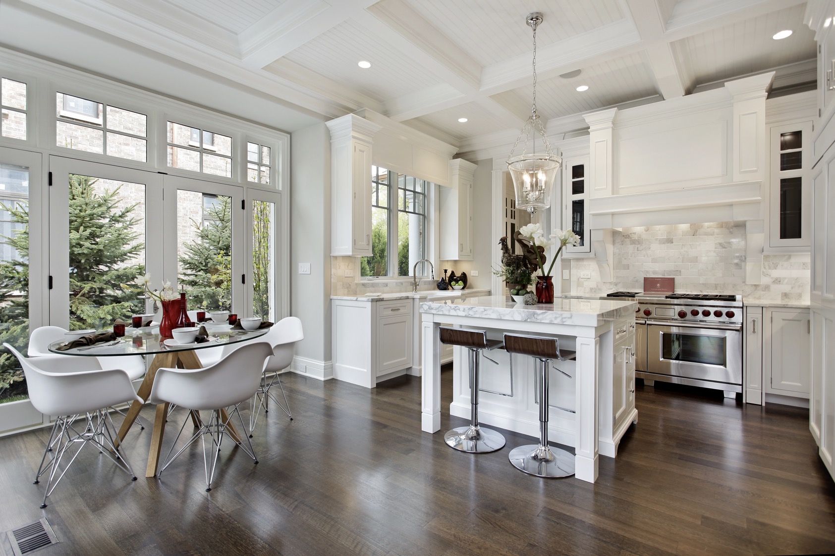 Kitchen in luxury home with white cabinetry.